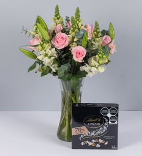 Arrangement Of Roses, Lilies And White Perritos With Bitter Lindt