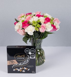 Arrangement Of Roses In Shades Of Pink And Lindt Bitter